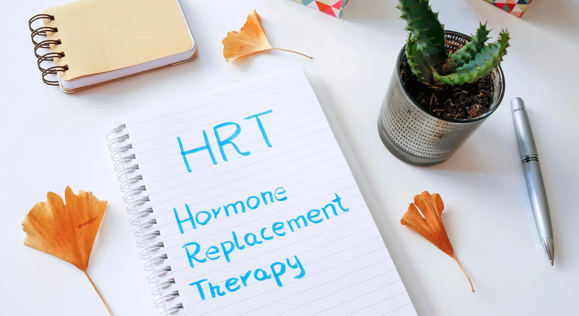 Hormone Replacement Therapy written on a note pad