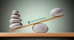 balance scale with more rocks on one side than the other