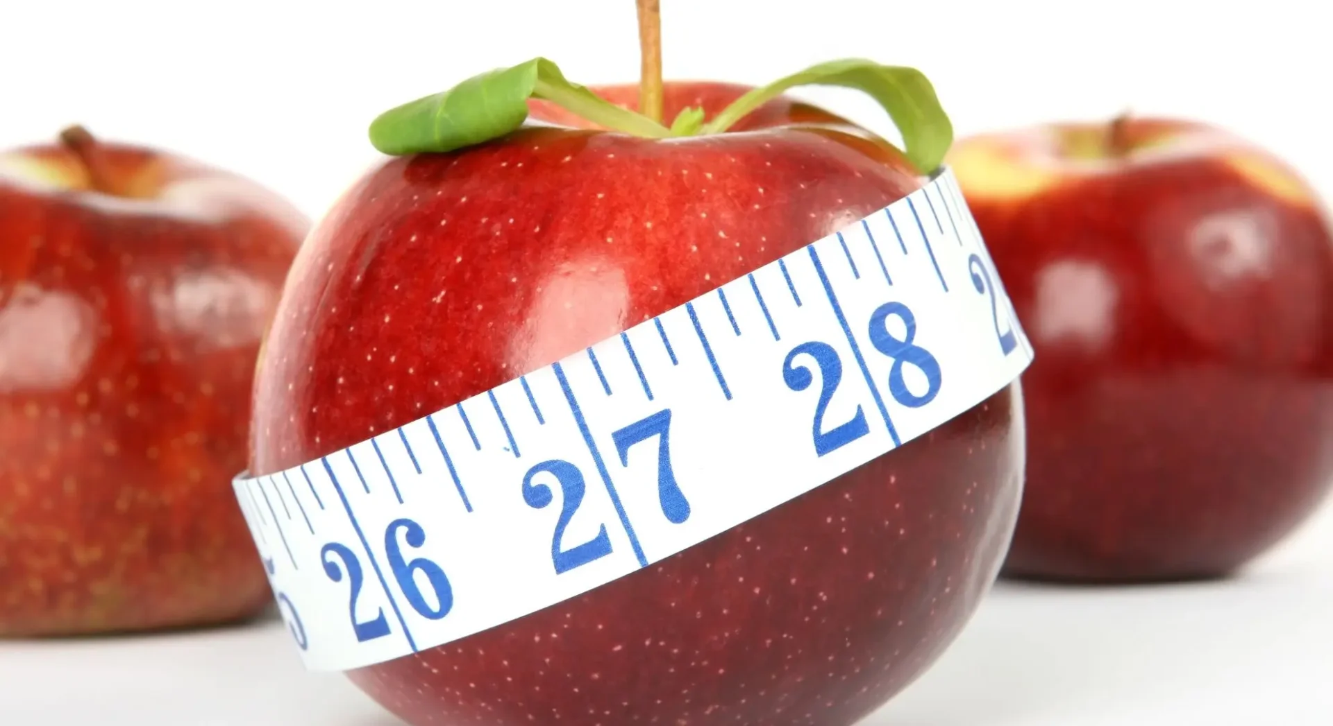 apple with tape measure around it