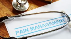 paper with the words pain management written on it